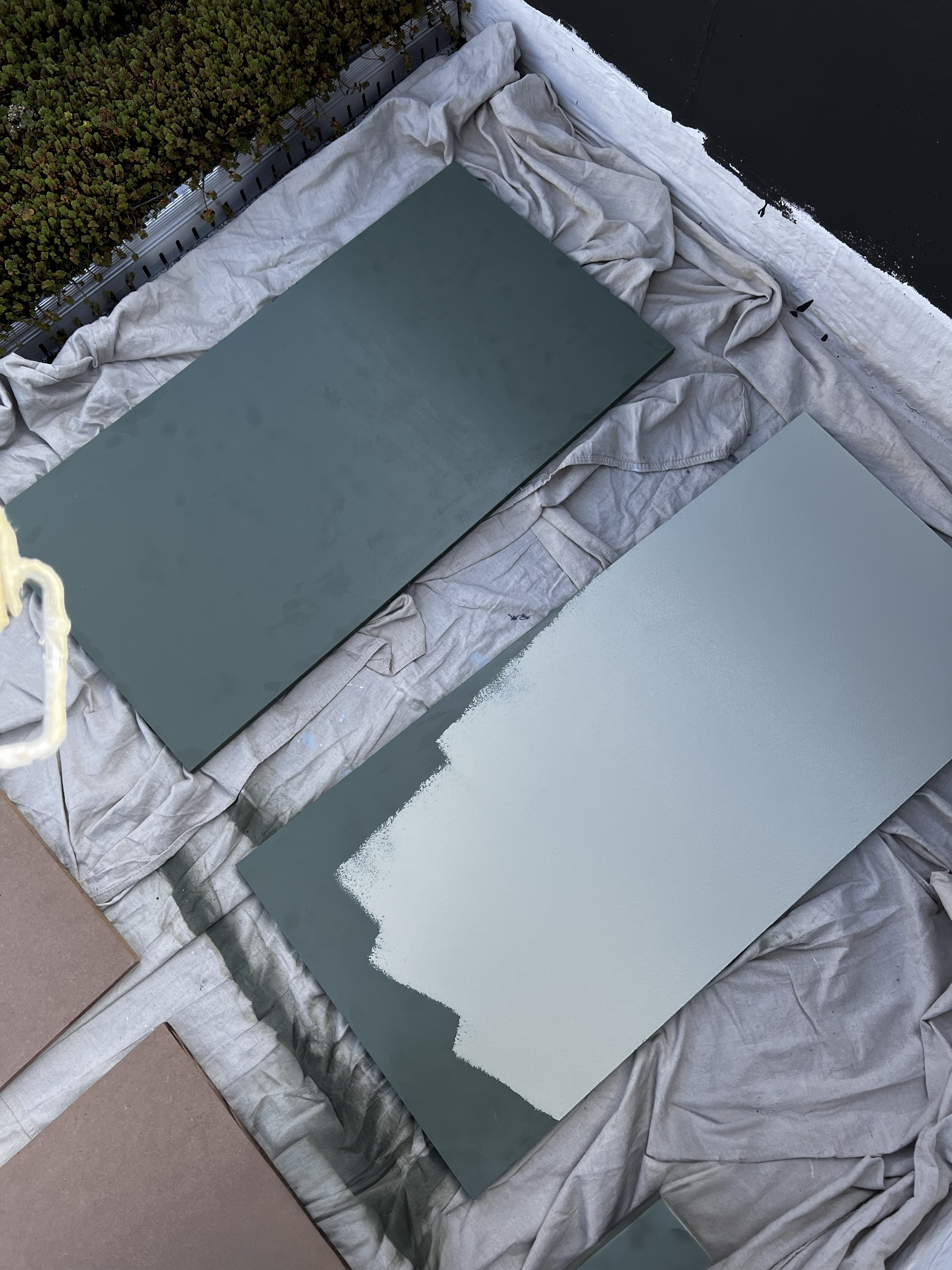Panels being painted on rooftop