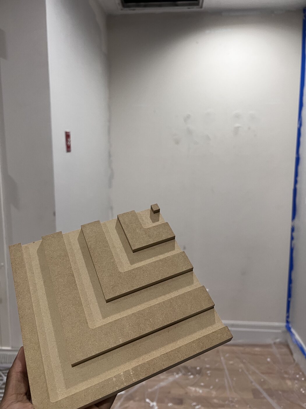 A stepped MDF panel sample from the Stacked Wood Lozenge-8844 profile — the selected face for the kitchen island